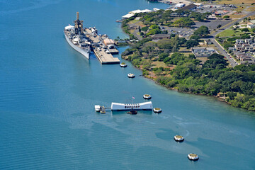 Aerial view of the Arizona memorial with the USS Misssouri in the background at Ford Island in...