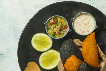 dressings for latin fried pie on black plate