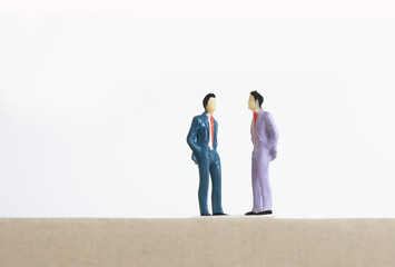 small figure of two businessman talking , business meeting concept