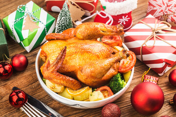 Roasted whole chicken with Christmas decoration.
