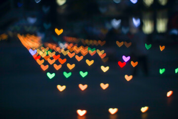 orange rainbow bokeh and blur heart shape love valentine day colorful night light on floor