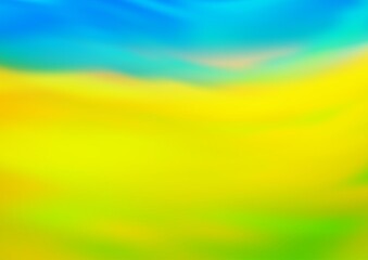Light Blue, Yellow vector blurred shine abstract background.
