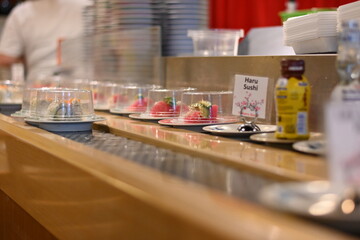 Plate sushi at a sushi bar