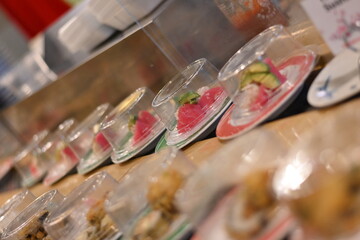 Plate sushi at a sushi bar