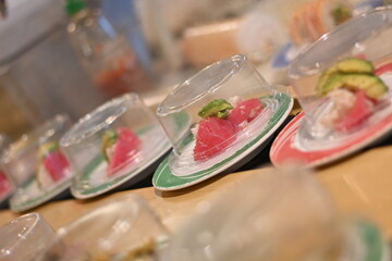 Plate sushi at a sushi bar