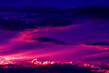 Pink sky with beautiful clouds. Charming sunset landscape. Sunny sunset