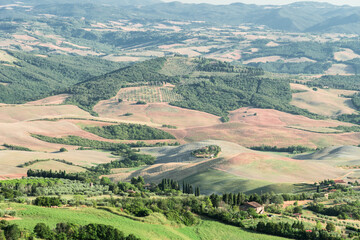 Fototapeta premium Tuscany Hills at sunset. Volterra panorama, rolling hills and green fields at sunset