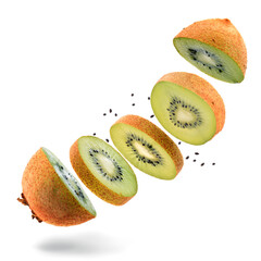 Kiwi fruit cutted into slices Fresh ripe parts with seeds are flying artistic isolated on white.