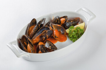 Blue mussels in tomatoes, white background
