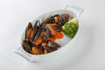 Blue mussels in tomatoes, white background