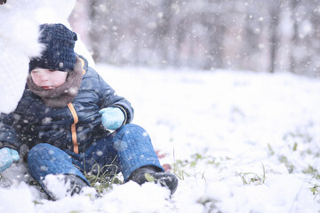 Kids walk in the park first snow