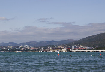 Fototapeta premium View of the city by the sea and mountains