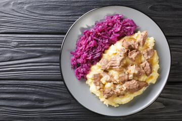 Tasty Hachee or hashay is a traditional Dutch winter dish with beef.  closeup in the plate on the table. horizontal top view from above