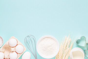 Ingredients for baking on light blue background.