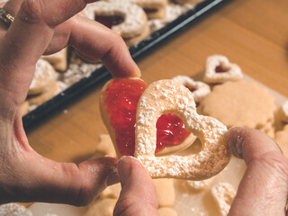 traditional christmas linz cookies heart shaped with red jam