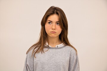 Obraz premium Girl student beautiful emotion surprise resentment sadness close-up white background