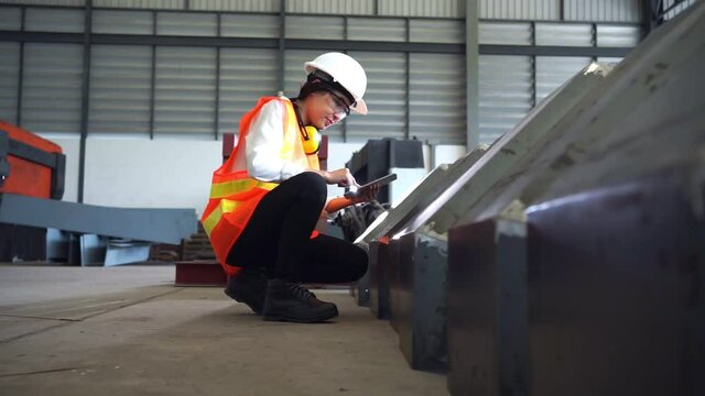 Female Engineers Are Inspecting The Workpiece In A Steel Factory.