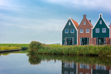 Volendam is a town in North Holland in the Netherlands. Colored houses of marine park in Volendam.