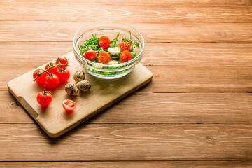 Summer salad: arugula, tomatoes, eggs, butter, spices