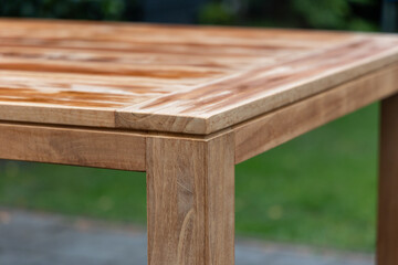 Outdoor teak dining table in the garden