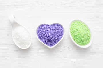 Various bath salt in the test tubes on the white background. Beauty treatment.