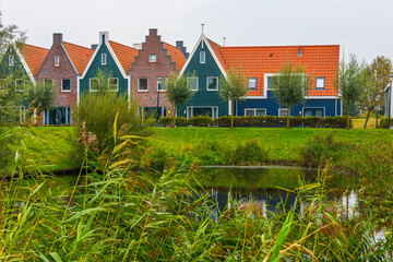 Volendam is a town in North Holland in the Netherlands. Colored houses of marine park in Volendam.
