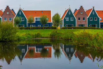 Volendam is a town in North Holland in the Netherlands. Colored houses of marine park in Volendam.