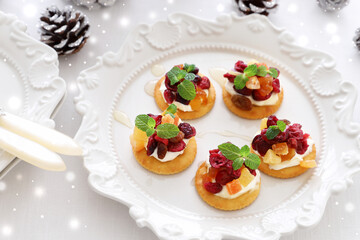Christmas canapes with dried cranberry and cream cheese....