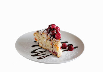 Piece of pie decorated with cherry berries on the top. Isolated on white background