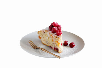 Piece of pie decorated with cherry berries on the top. Isolated on white background