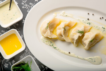 delicious warm homemade dumplings with sauce and spices