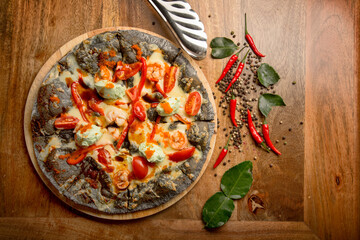 Italian pizza from the chef with tomatoes, cheese and spices