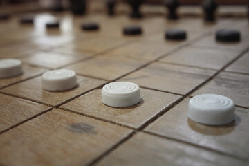 Soft and selective focus A white pawn chess on Thai chess board.
