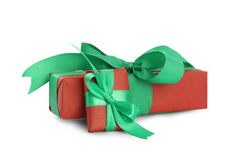 Christmas gift boxes decorated with green bows on white background