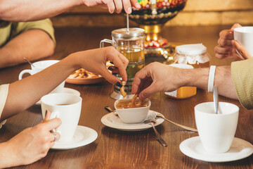 Friends drink herbal tea after spa treatments in the sauna. Concept - healthy lifestyle