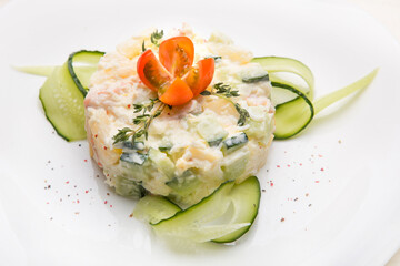 Fresh vegetables with white sauce and cucumbers