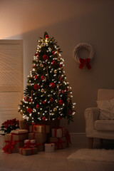 Beautiful decorated Christmas tree in living room. Festive interior