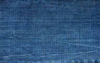 texture of dark blue denim. Focusing in the center of the frame.