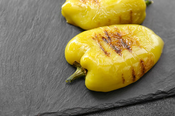 Grilled bell peppers on dark background