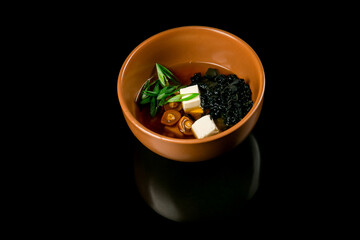 Soup with algae and mushrooms. Japanese food