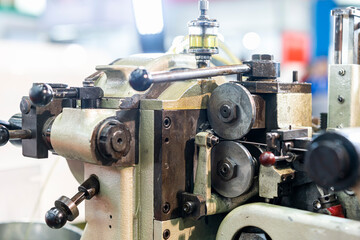 Fototapeta premium Drive wheel of metal wire feeder unit continuous automatic pin or plug making machine for industrial