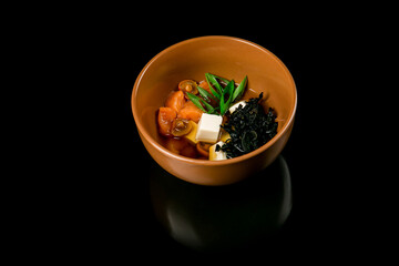 Soup with mushrooms and salmon. Japanese food
