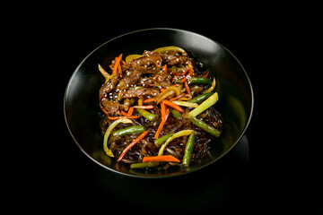 Wok noodles with beef and vegetables. Japanese food