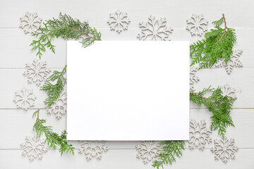 Beautiful Christmas composition with blank card on white wooden background