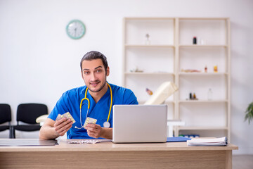 Young male doctor working in the clinic