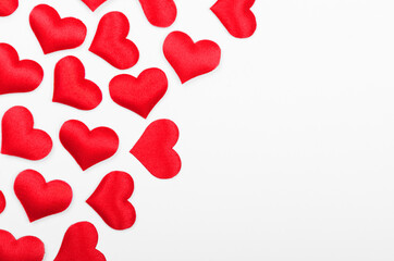 Frame made of red hearts on white background