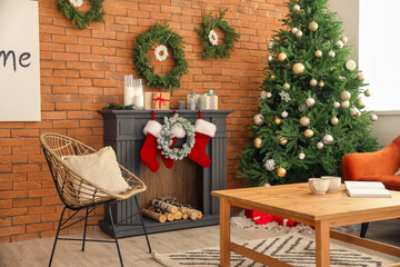 Interior of living room with fireplace decorated for Christmas