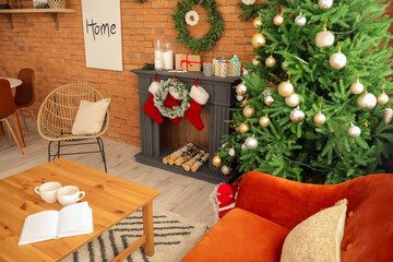 Interior of living room with fireplace decorated for Christmas