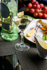 Martini glass with a bottle. Snacks for vermouth. Snacks for Martini.