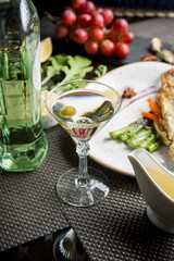 Martini glass with a bottle. Snacks for vermouth. Snacks for Martini.